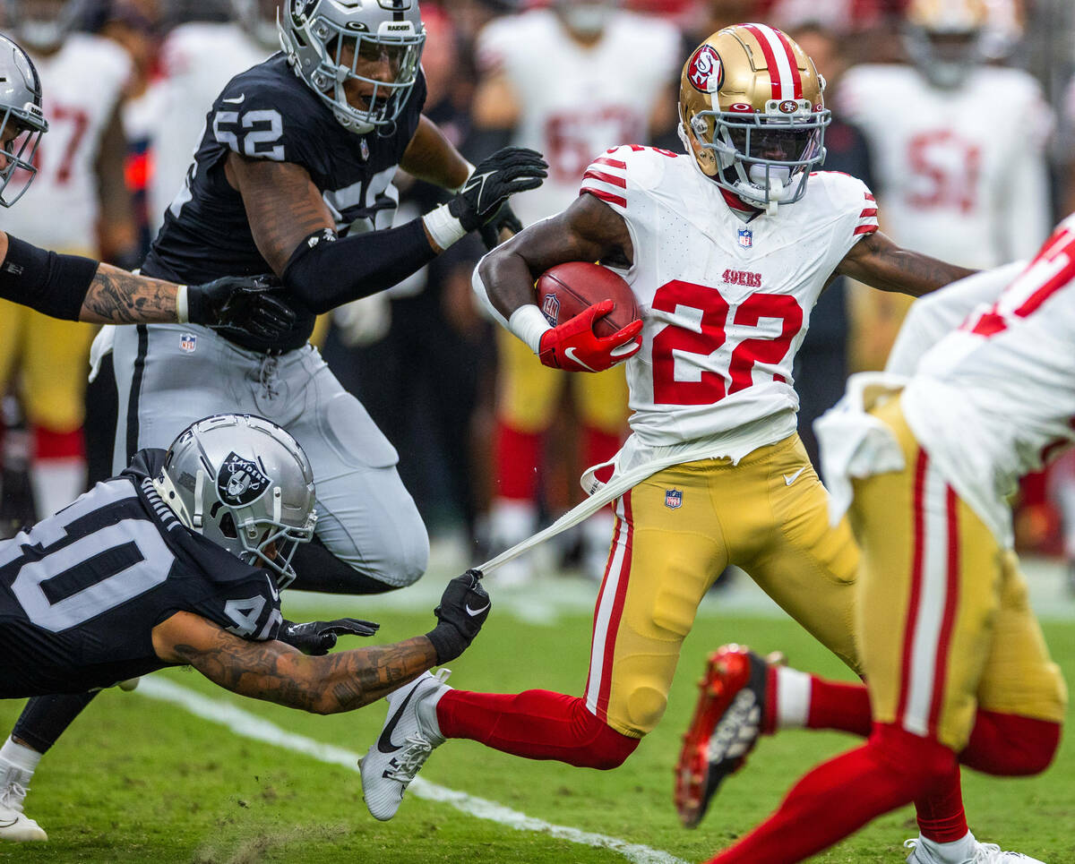 Raiders safety Jaydon Grant (40) gets just a bit of t-shirt while attempting to stop San Franci ...