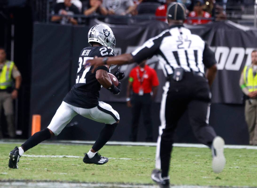 Raiders cornerback Sam Webb (27) runs after intercepting the ball during the second half of an ...