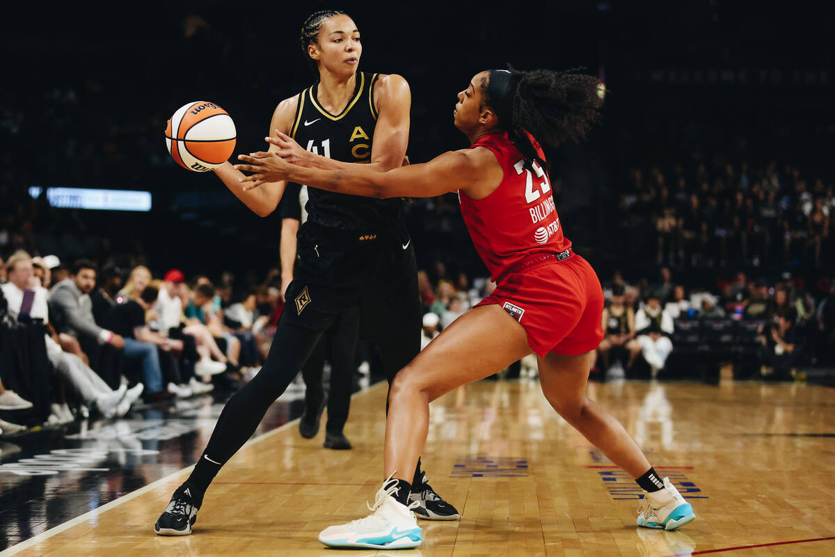 Aces center Kiah Stokes (41) attempts to pass the ball to a teammate as Atlanta Dream forward M ...