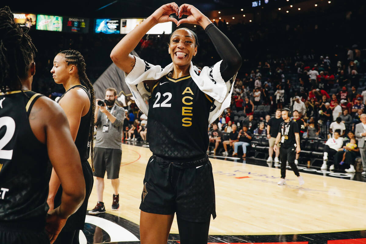 Aces center A’ja Wilson makes a heart with her hands after beating the Atlanta Dream 86- ...