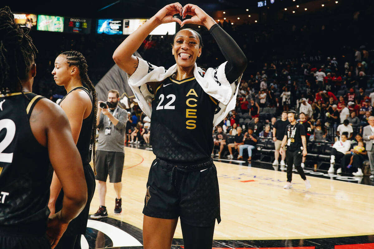 Aces center A’ja Wilson makes a heart with her hands after beating the Atlanta Dream 86- ...