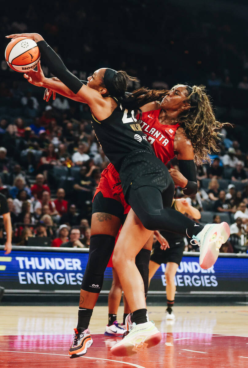Aces center A’ja Wilson (22) fights for possession of the ball with Atlanta Dream forwar ...