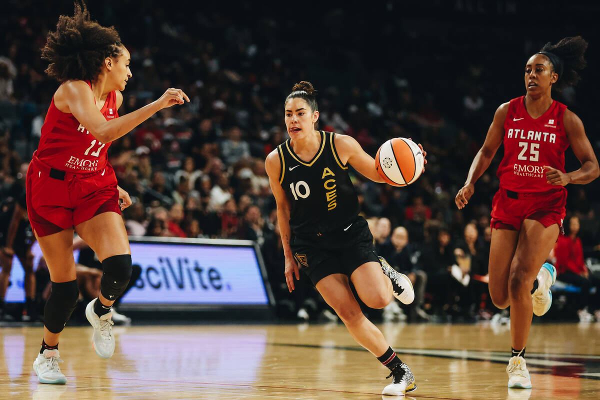 Aces guard Kelsey Plum (10) dribbles the ball down the court during a game against the Atlanta ...