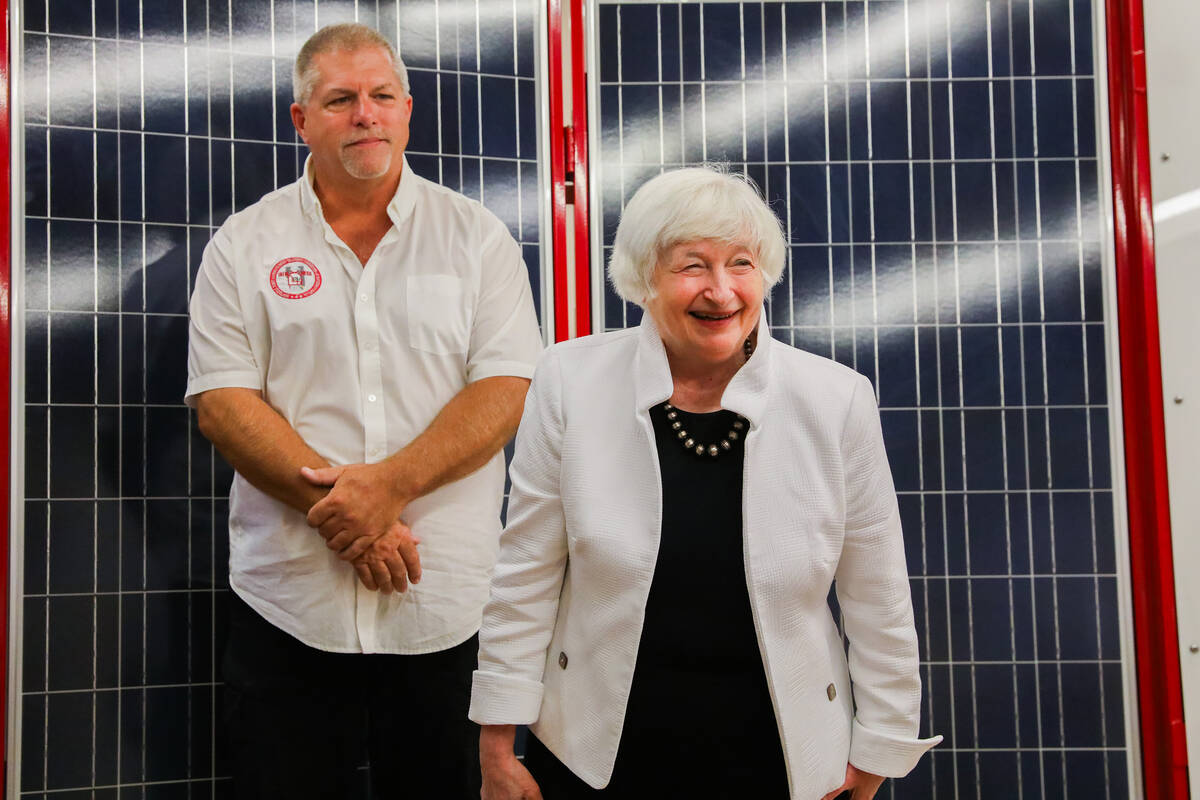 Secretary of Treasury Janet Yellen accompanies Guy Snow, senior renewable energy instructor, du ...