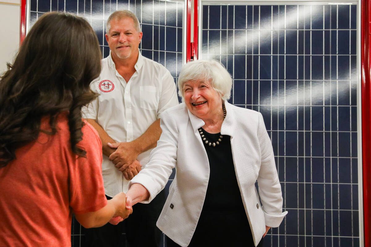 Secretary of Treasury Janet Yellen greets Rachelle Warren, 1st year apprentice, alongside Guy S ...