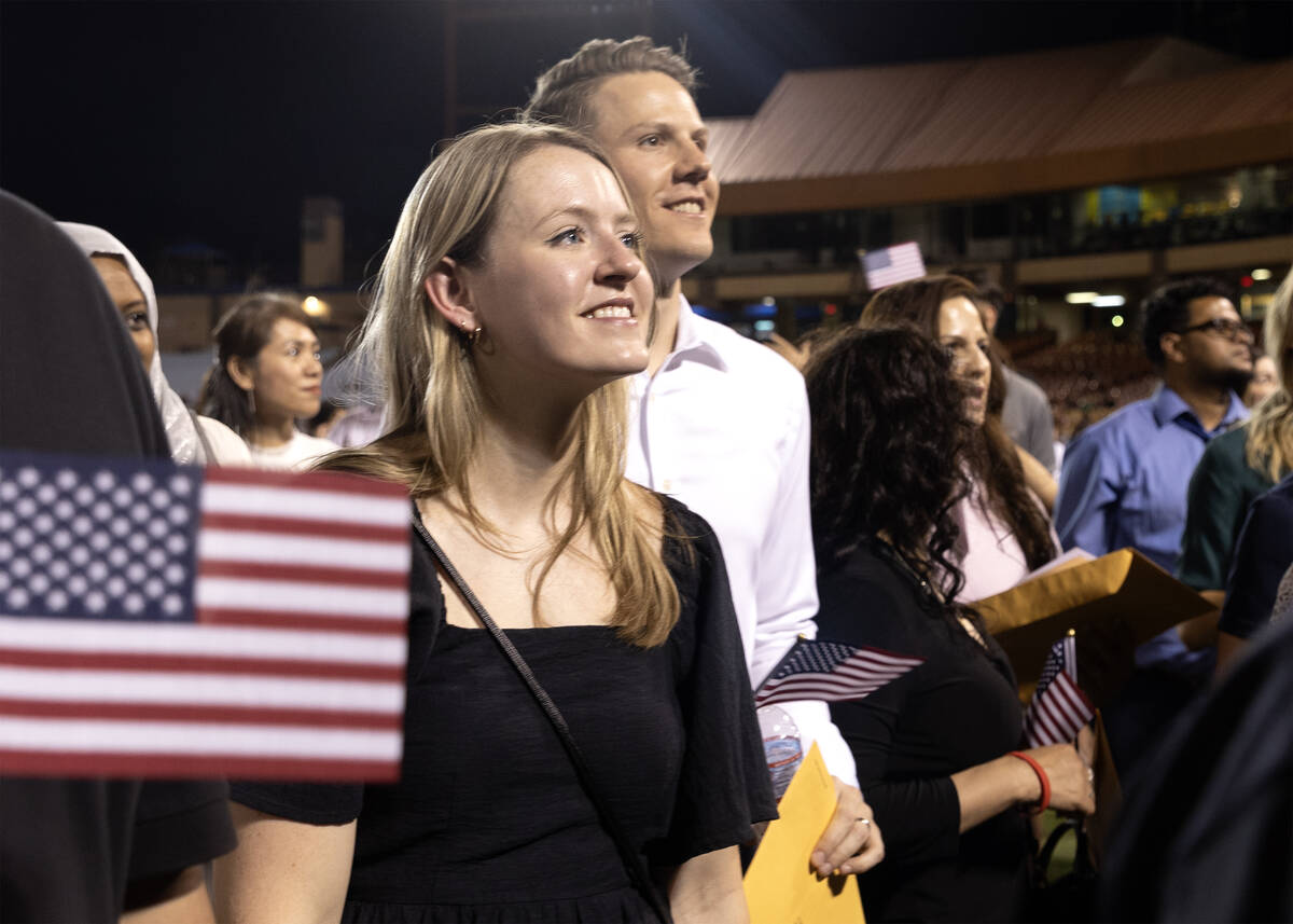 Dawn Karchko, left, followed by her husband Brenden Karchko, of Canada, leave the field during ...