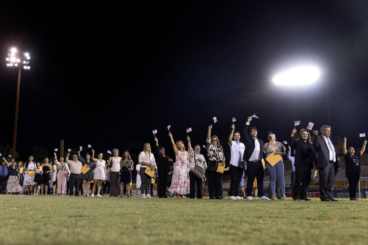 250 new U.S citizens take the field during halftime of a Las Vegas Lights soccer game for their ...