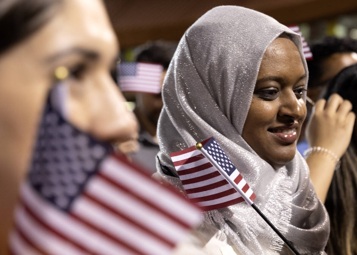 Newly naturalized U.S citizens leave the field during halftime of a Las Vegas Lights soccer gam ...