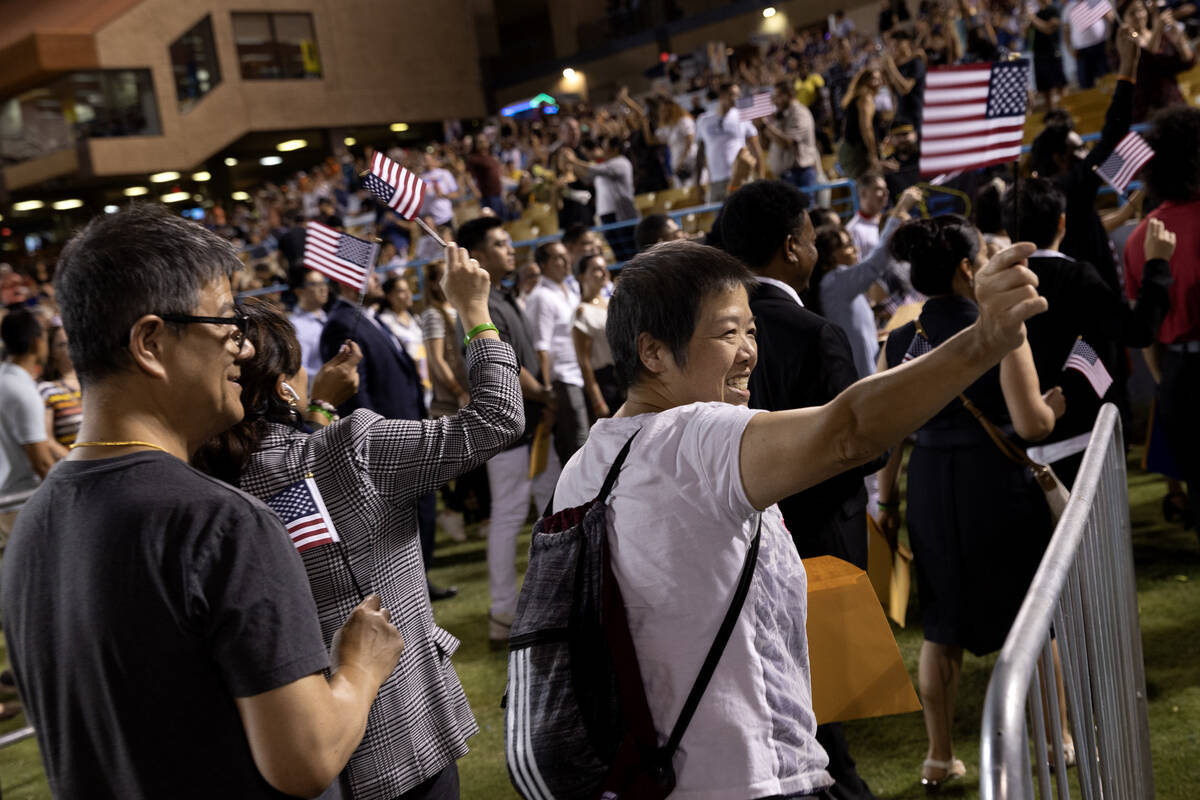 Newly naturalized U.S citizens leave the field during halftime of a Las Vegas Lights soccer gam ...
