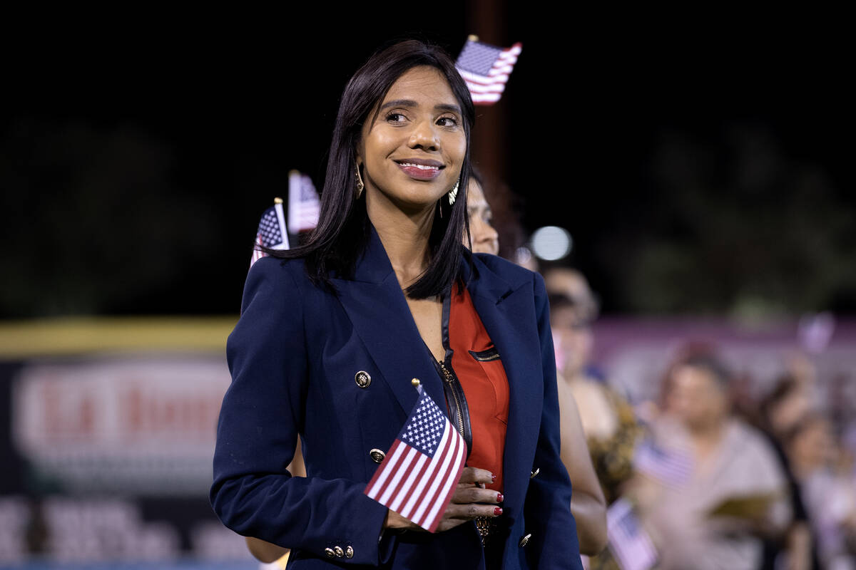 A new U.S. citizen is among 250 to be naturalized on the field during halftime of a Las Vegas L ...