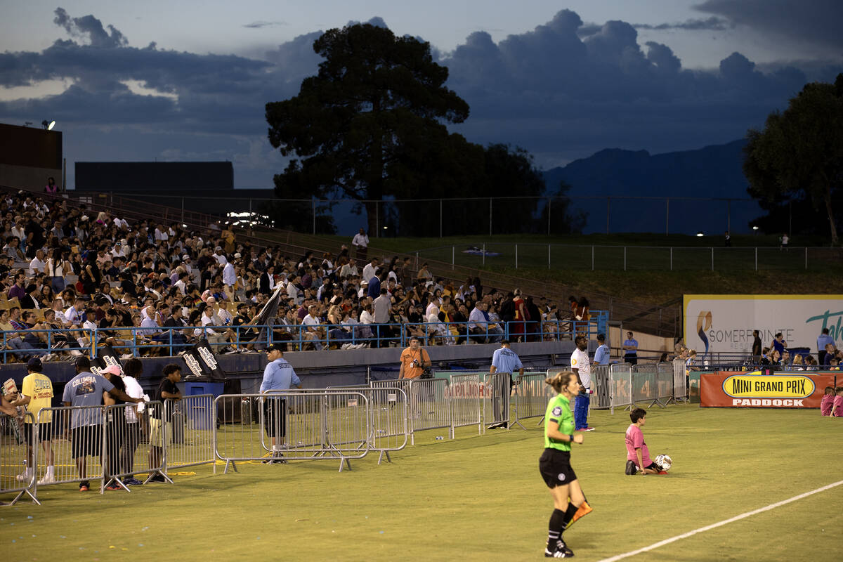 New U.S citizens and their families fill the stands during a Las Vegas Lights soccer game at Ca ...