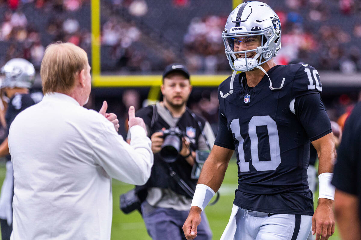 Raiders owner Mark Davis gives the "thumbs up" to quarterback Jimmy Garoppolo (10) du ...