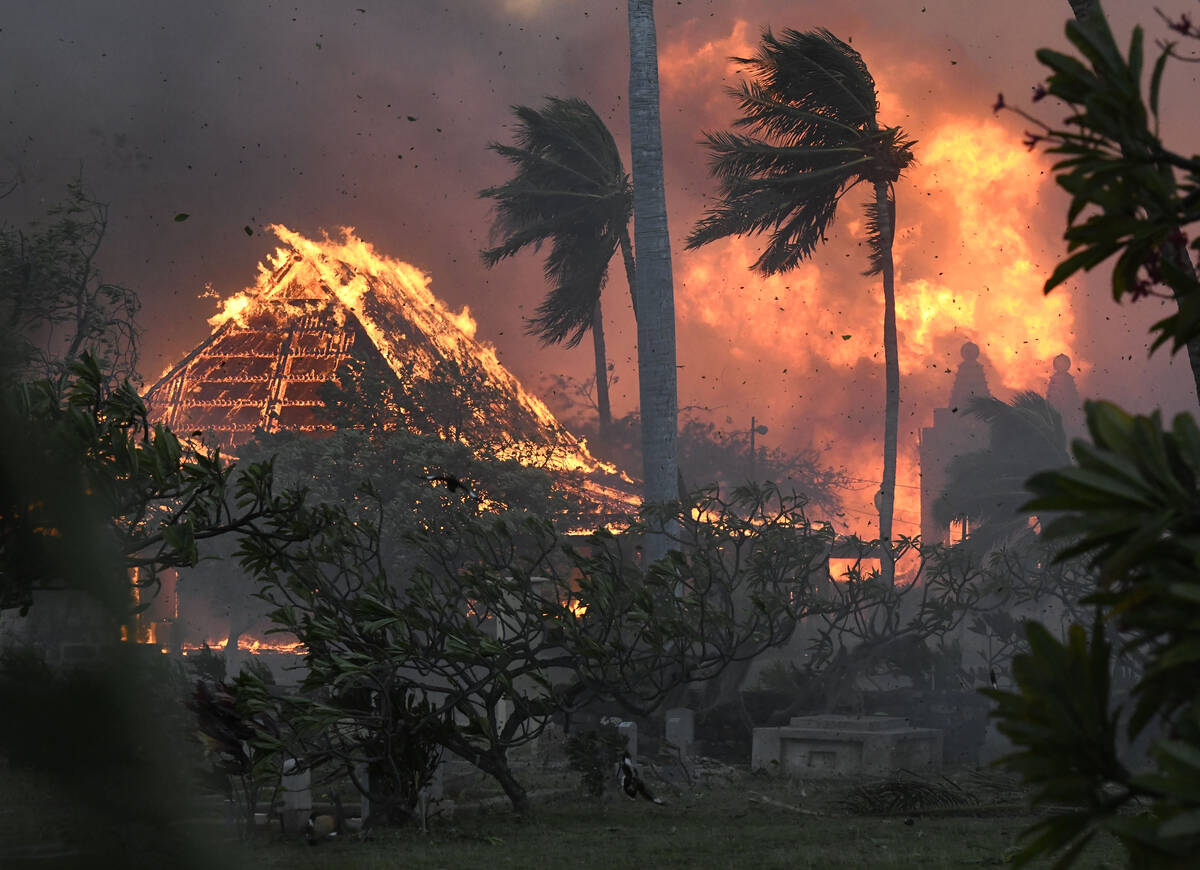 The hall of historic Waiola Church in Lahaina and nearby Lahaina Hongwanji Mission are engulfed ...