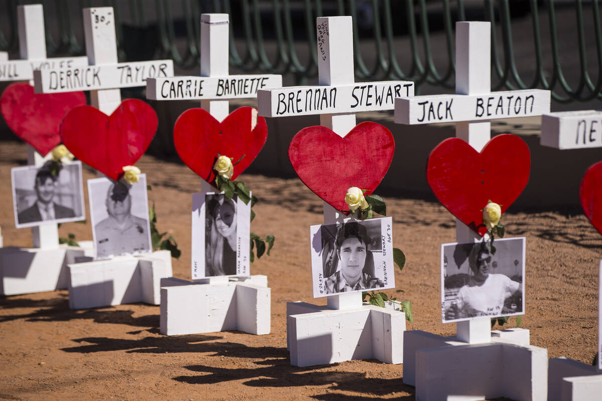 Some of the 58 crosses near the "Welcome to Fabulous Las Vegas" sign placed by Greg Z ...