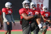 UNLV defensive end Jameer Outsey (20) stretches during team practice on Thursday, Aug. 9, 2018, ...