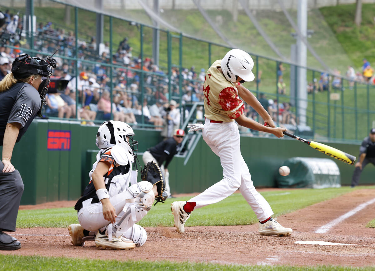 The Henderson All-Stars JoJo Dixon swings-and-misses a pitch from Rhode Island pitcher Brayden ...