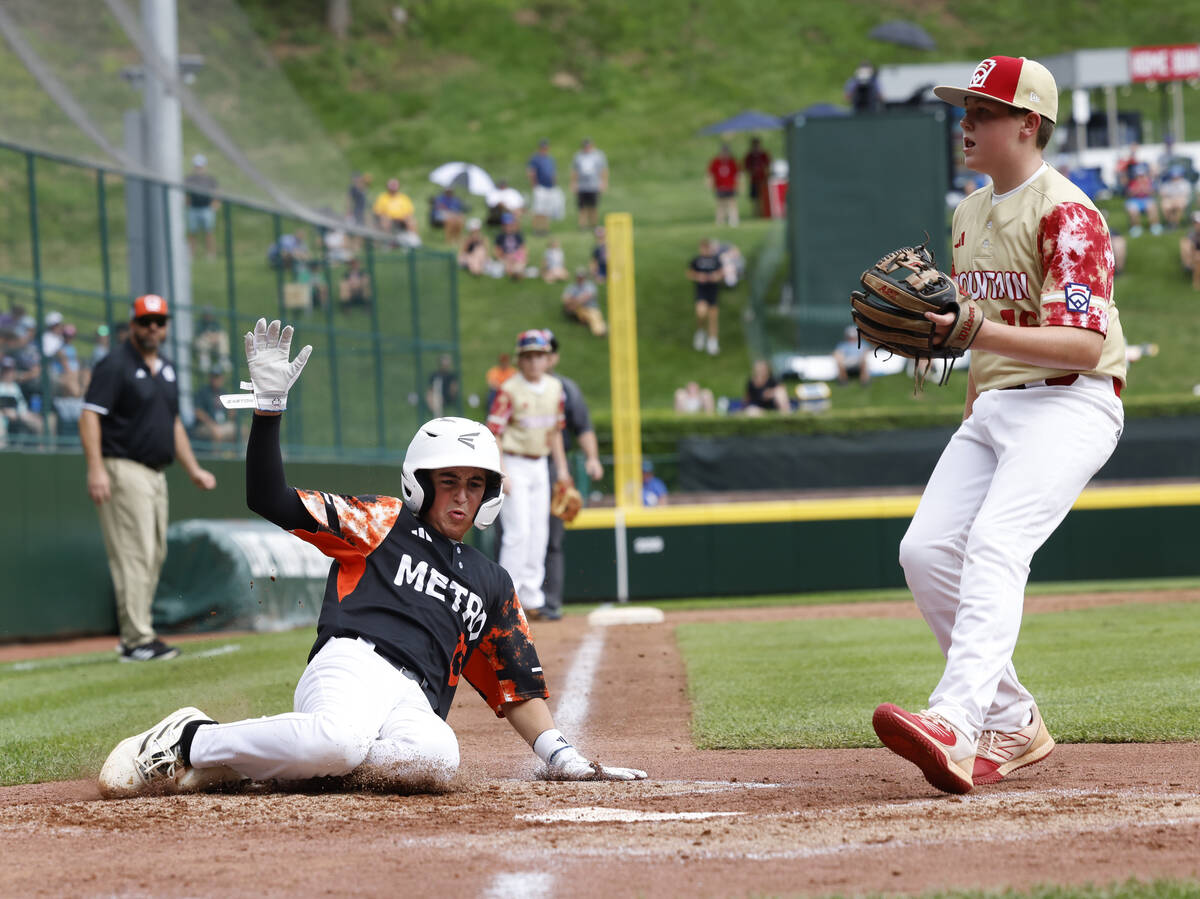 Rhode Island's Brayden Castellone beats a throw and scores before Henderson All-Stars pitcher L ...
