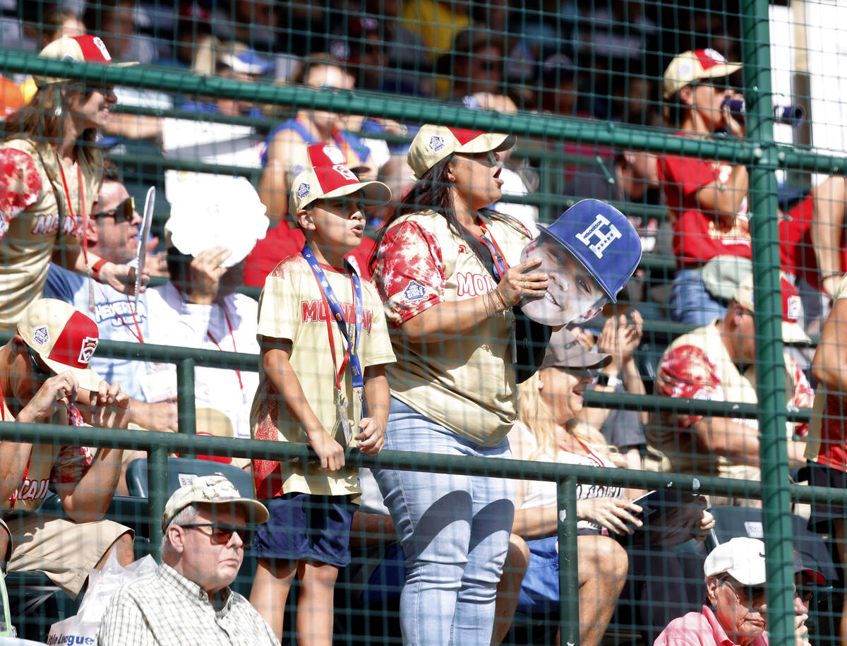 Fans cheer for Henderson All-Stars during the Little League World Series tournament against Rho ...