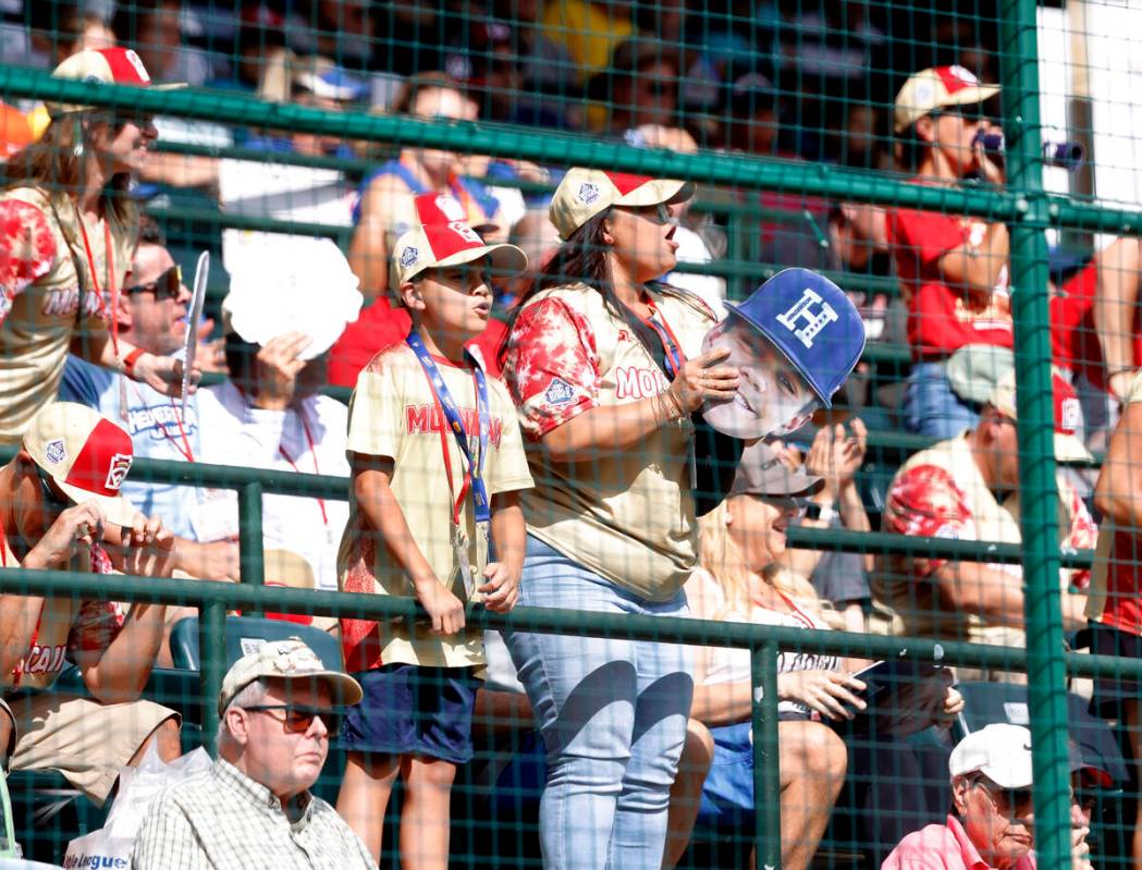 Fans cheer for Henderson All-Stars during the Little League World Series tournament against Rho ...