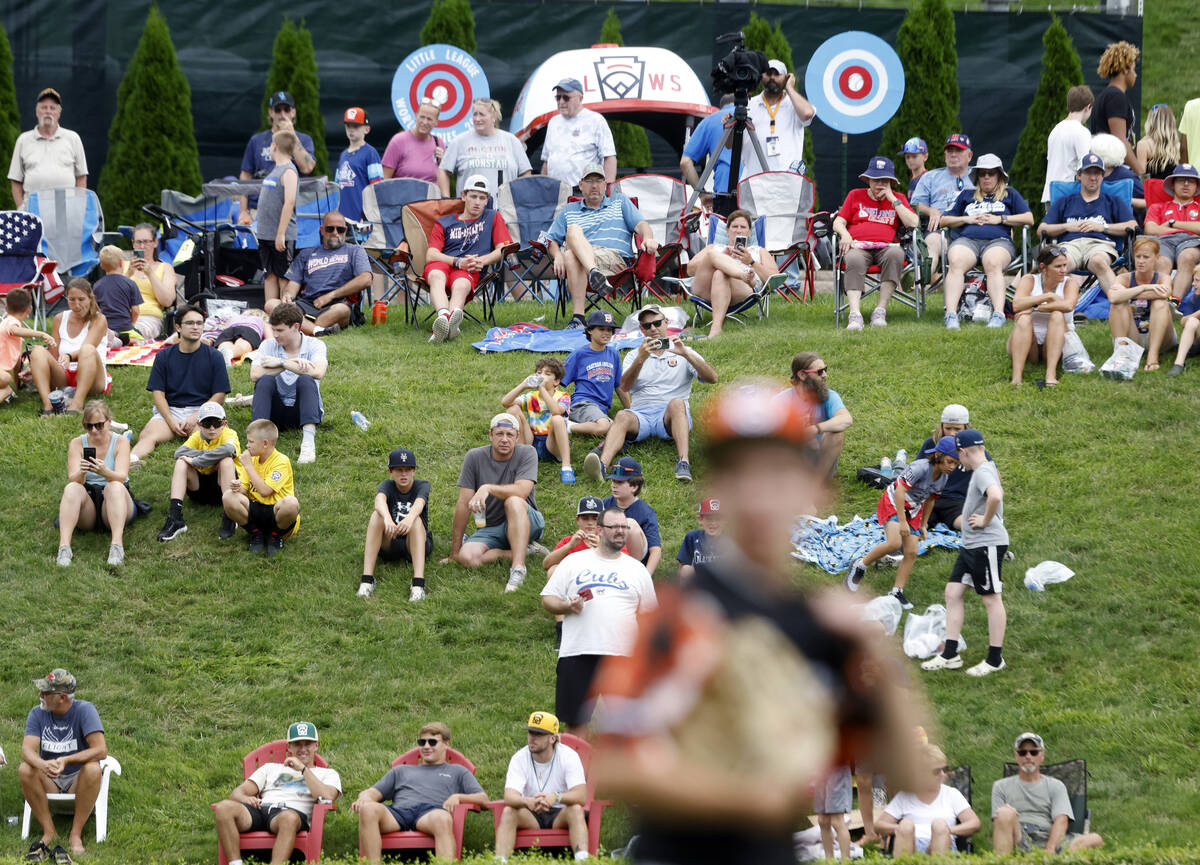 Fans watch baseball game between Henderson All-Stars and Rhode Island during the Little League ...