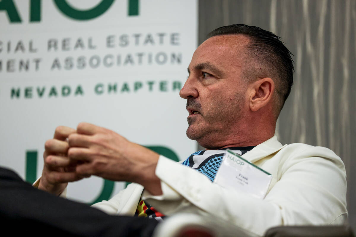 Frank Volk, vice president of business development for CBRE, speaks on a panel about experienti ...