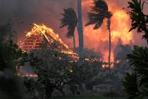 The hall of historic Waiola Church in Lahaina and nearby Lahaina Hongwanji Mission are engulfed ...