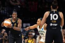 Las Vegas Aces guard Chelsea Gray (12) struggles to communicate with guard Kelsey Plum (10) whi ...