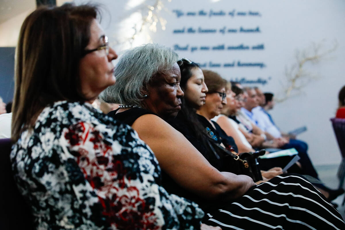 Ruhi Rohani, left, and Barbara Weems, second left, listen and meditate during a prayer at a dev ...