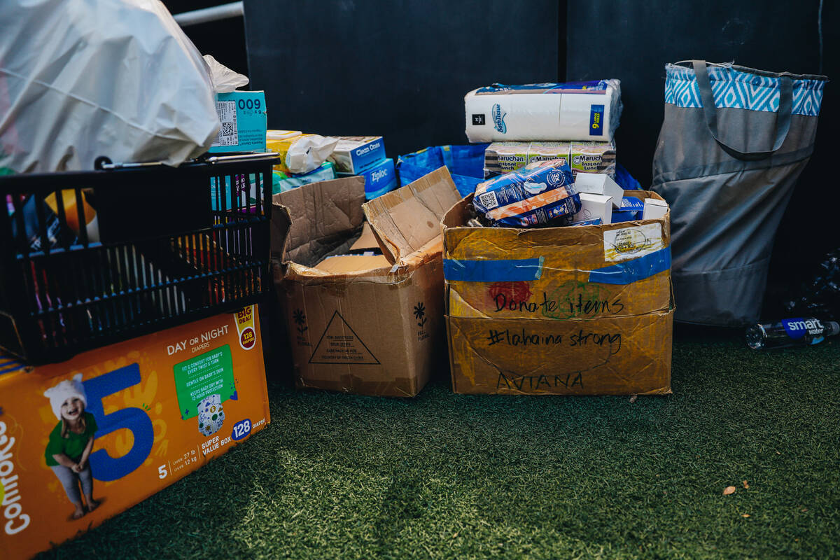 Donated toiletries for victims of the Maui wildfires are seen next to the Container Park stage ...