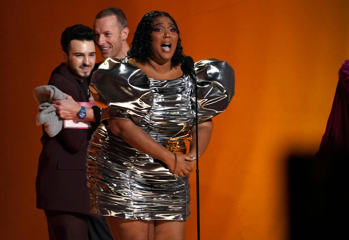 Lizzo accepts the award for record of the year for "About Damn Time" at the 65th annu ...