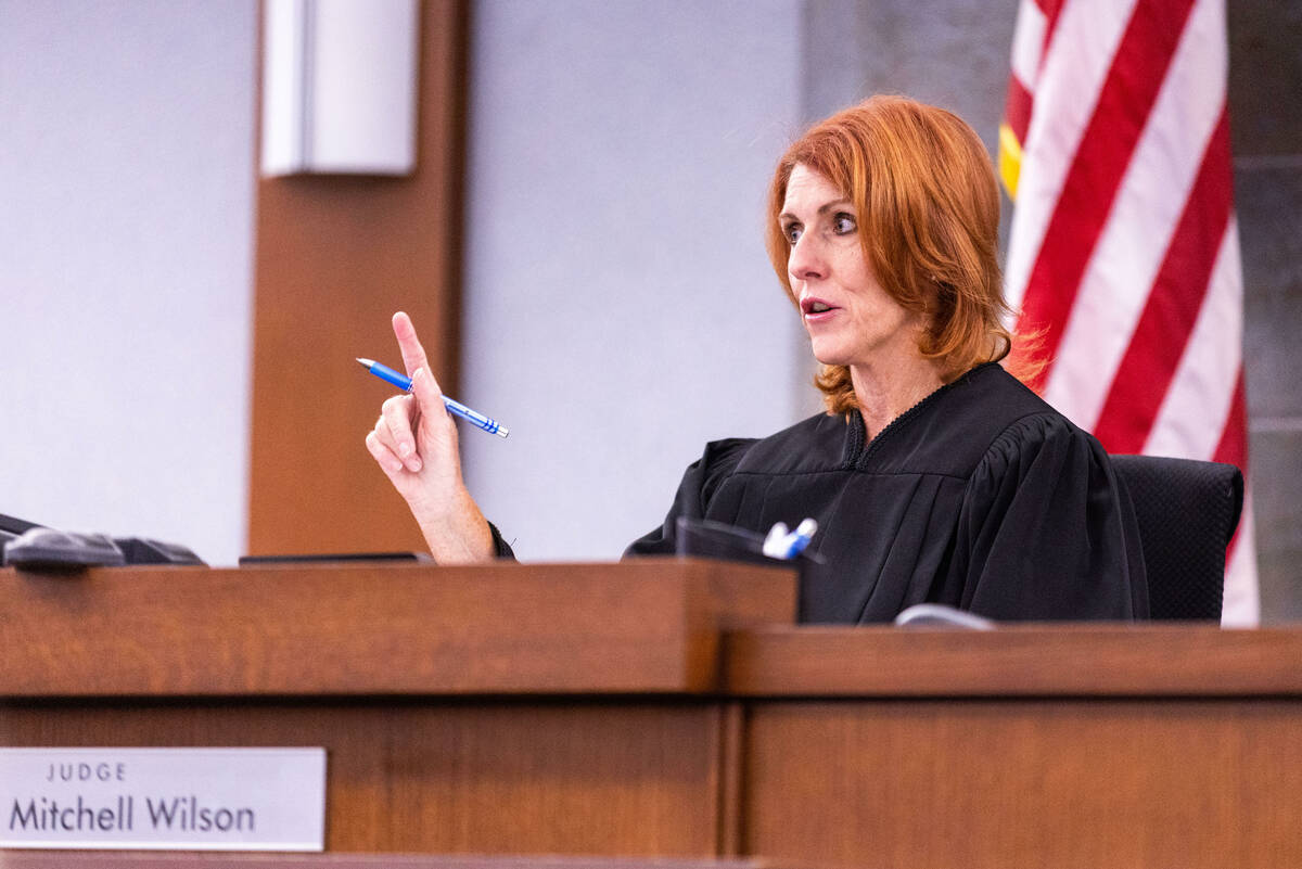 Judge Amy Mitchell Wilson speaks to a defendant in her courtroom at the Regional Justice Center ...
