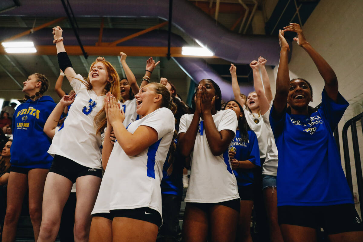 The Sierra Vista student section cheers as their girls volleyball team gets a point during a ma ...