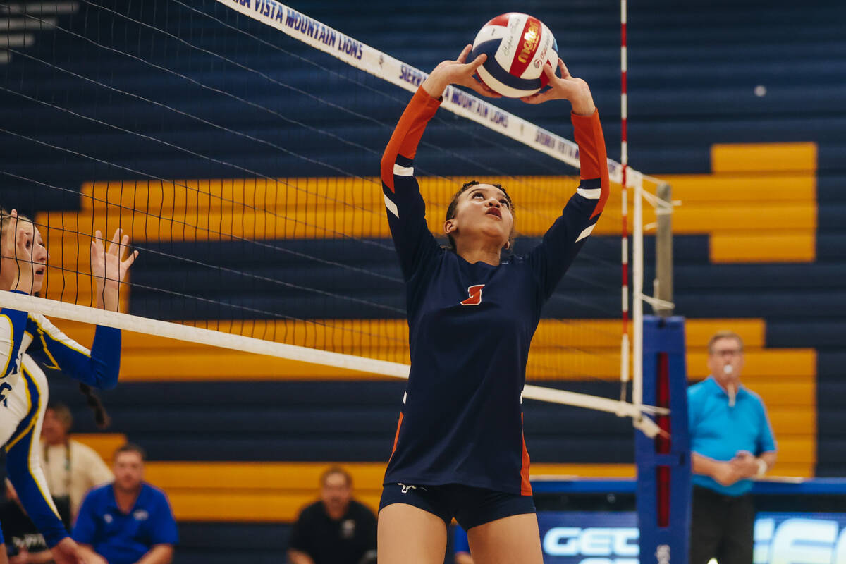 Legacy setter Miy’aja Diggs jumps up for the ball during a match against Sierra Vista at ...