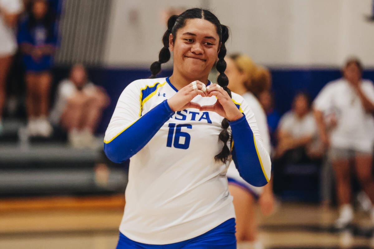 Sierra Vista outside hitter Ariella Maika makes a heart gesture with her hands to a teammate on ...