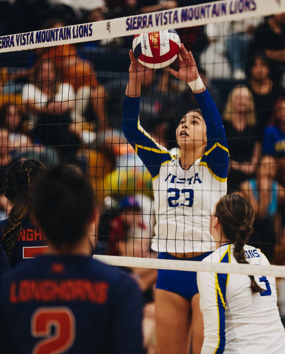 Sierra Vista setter Angelina Degrange (23) sends the ball back over the net during a match up a ...