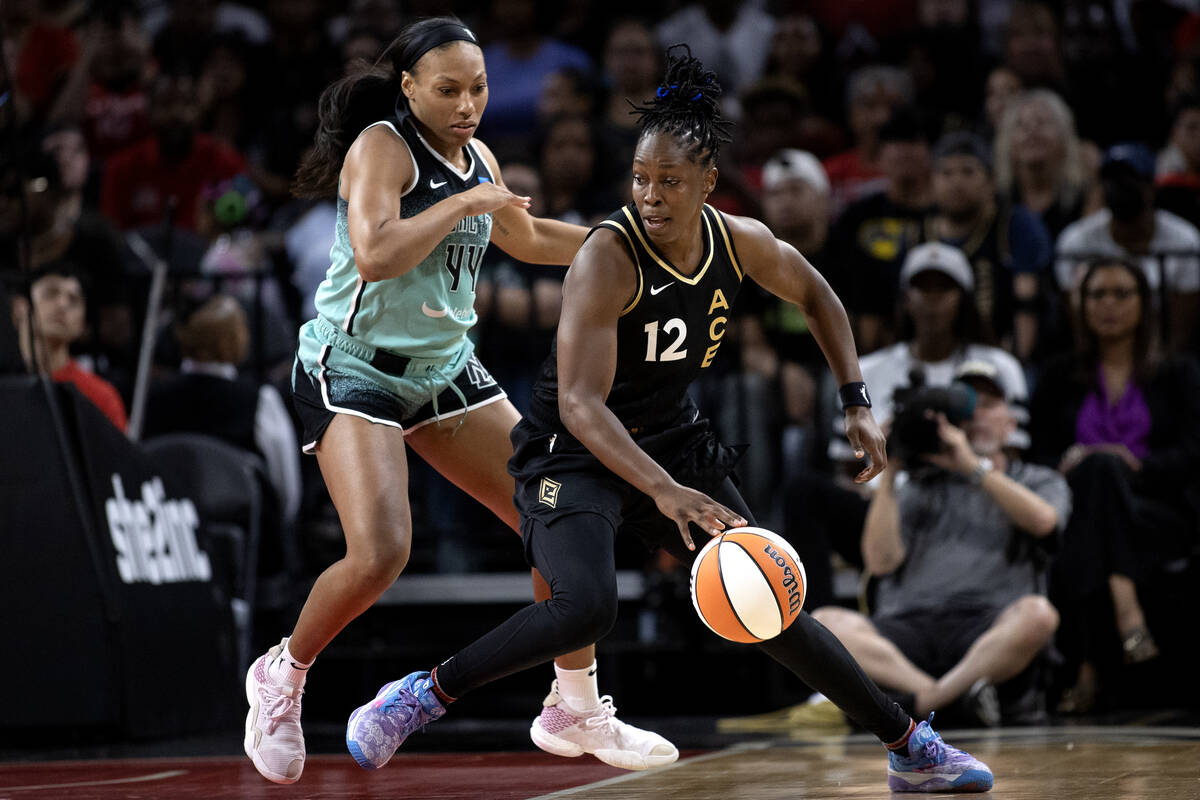 Las Vegas Aces guard Chelsea Gray (12) works the ball against New York Liberty forward Betnijah ...