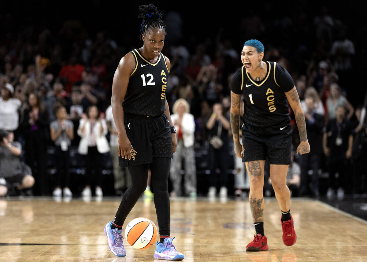 Las Vegas Aces guard Chelsea Gray (12) dribbles away the game’s final seconds while Aces guar ...