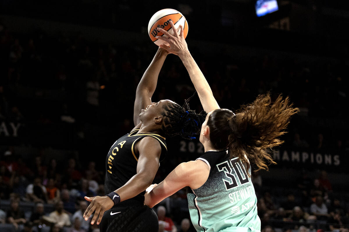 Las Vegas Aces guard Chelsea Gray (12) shoots against New York Liberty forward Breanna Stewart ...