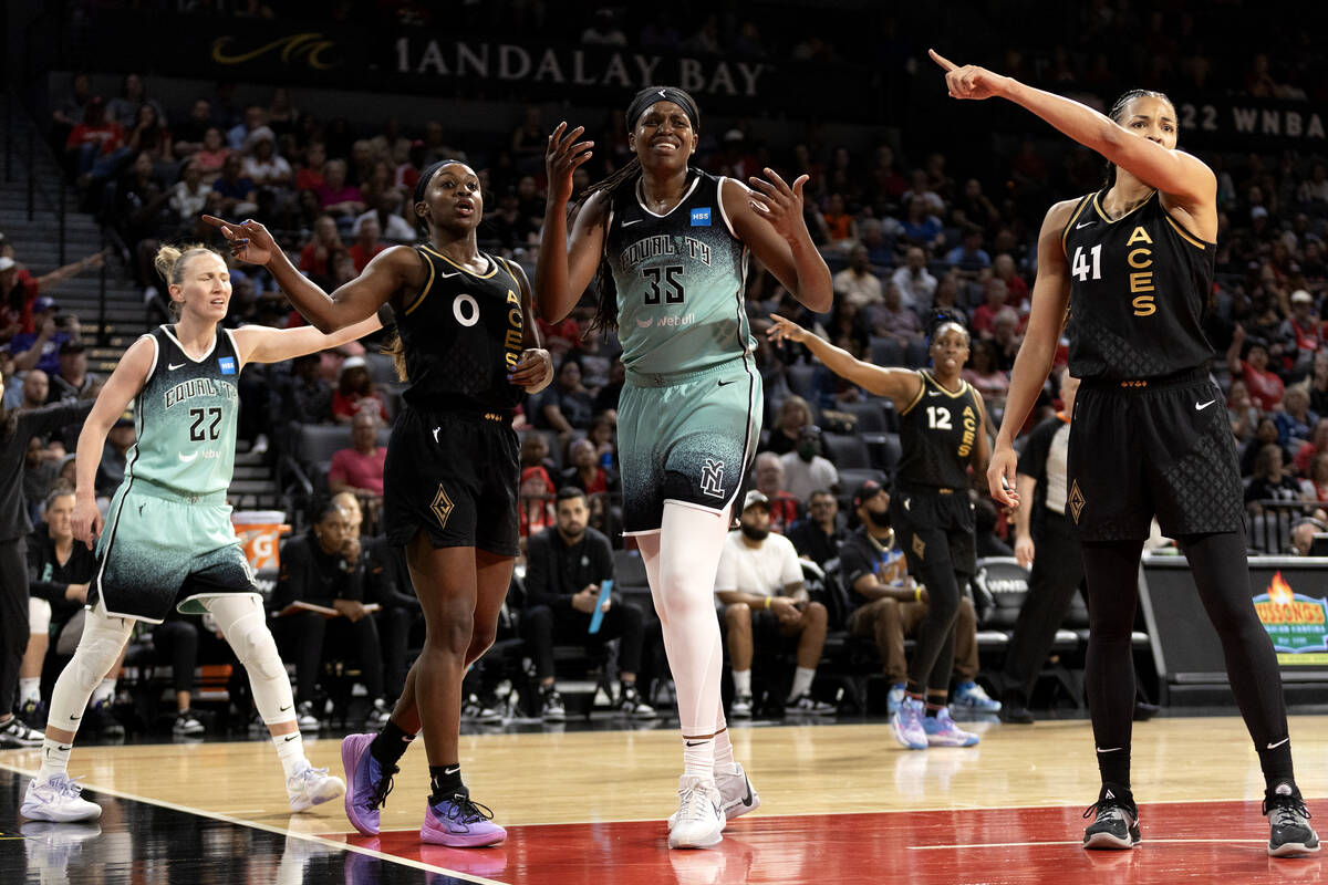 New York Liberty guard Courtney Vandersloot (22), Las Vegas Aces guard Jackie Young (0), Libert ...