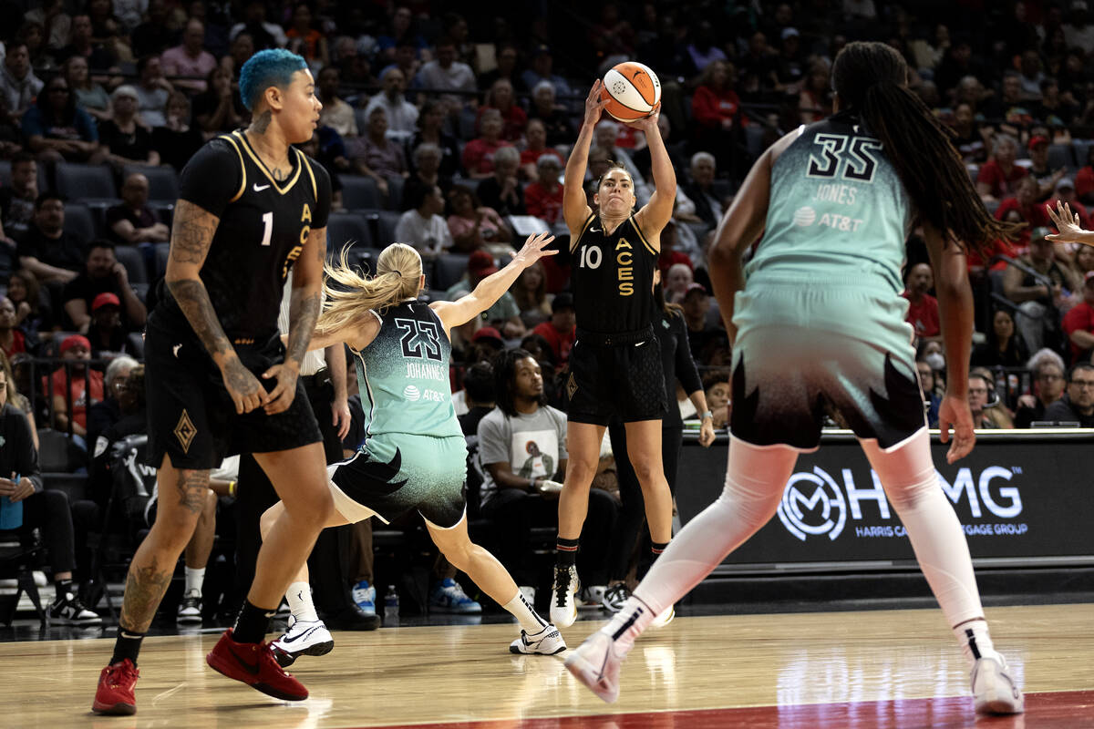 Las Vegas Aces guard Kelsey Plum (10) shoots a three-pointer while New York Liberty guard Marin ...
