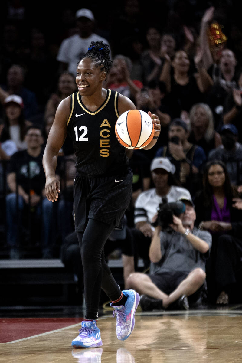 Las Vegas Aces guard Chelsea Gray (12) walks up the court with a smile during final seconds of ...