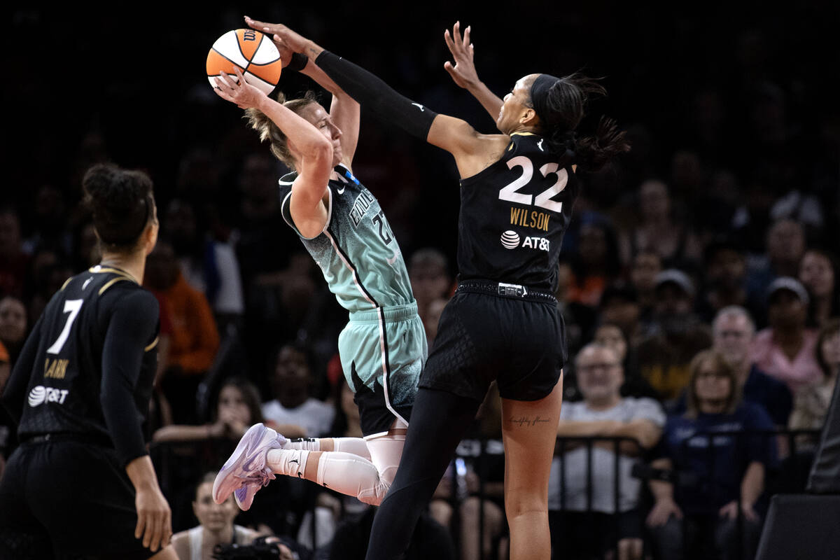 New York Liberty guard Courtney Vandersloot (22) shoots while Las Vegas Aces forward A'ja Wilso ...