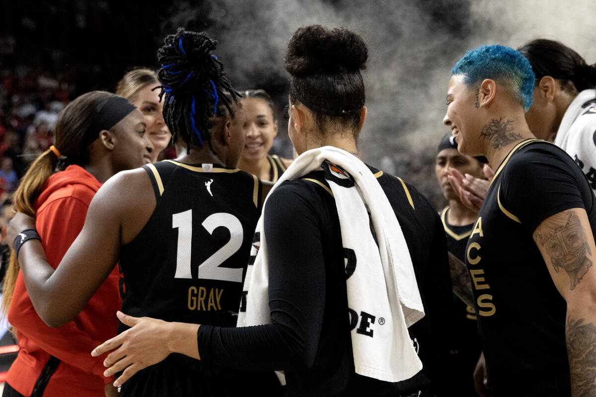 The Las Vegas Aces gather to celebrate their win over the New York Liberty in a WNBA basketball ...
