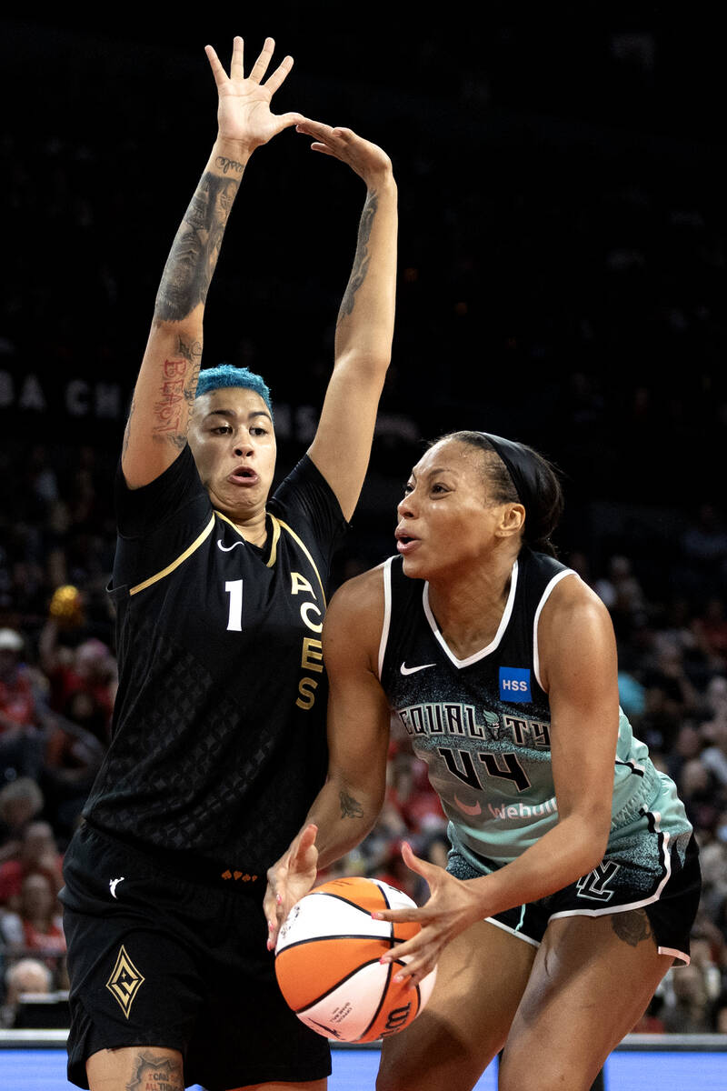 Las Vegas Aces guard Kierstan Bell (1) defends against New York Liberty forward Betnijah Laney ...