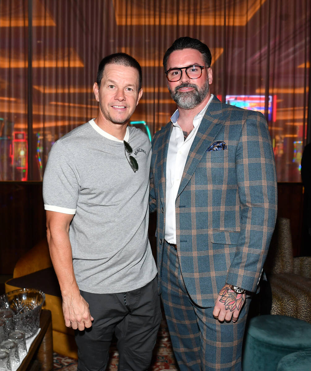 Mark Wahlberg and 81/82 Group founder Ryan Labbe are shown at the grand opening of Juliet Cock ...