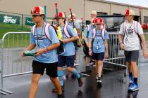 The Henderson All-Stars leave the batting cage after their hitting practice as they prepare to ...