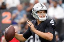 Raiders quarterback Aidan O'Connell (4) throws a pass during the second half of an NFL preseaso ...