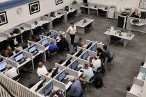 Job seekers fill out applications at EmployNV Career Hub in Las Vegas on Thursday, July 27, 202 ...