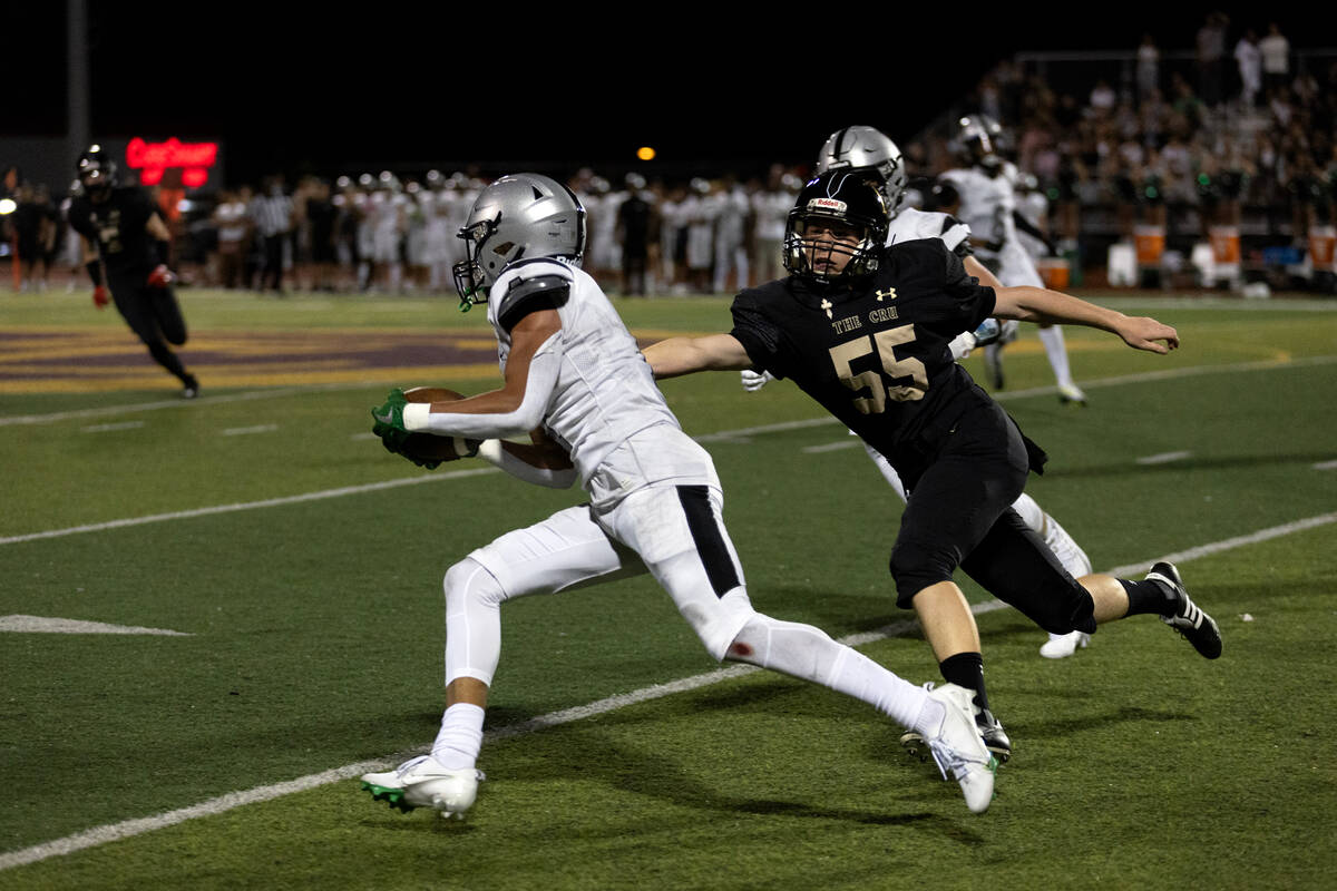 Palo Verde wide receiver Furious Hoskins, left, runs the ball while Faith Lutheran’s Rya ...
