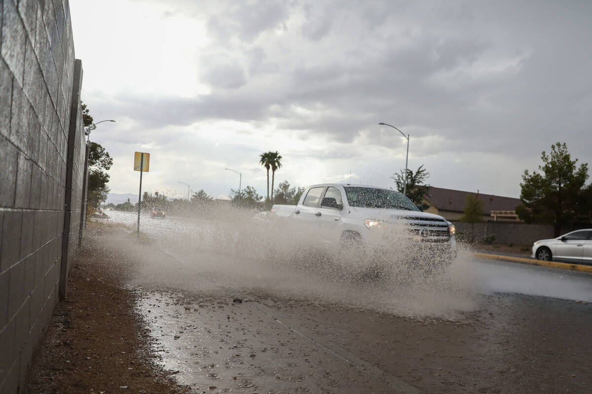 Cars battle rush hour traffic amidst flash flood along Eastern Avenue and Robindale Road on Fri ...